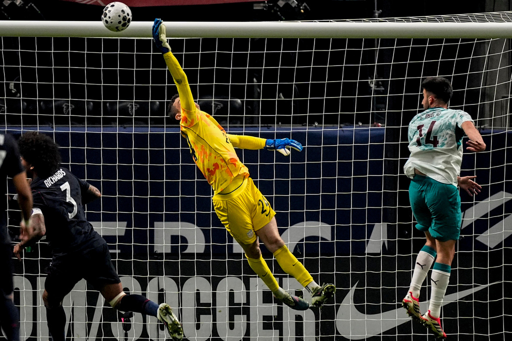 USA goalkeeper Matt Freese(24) makes a save against Portugal during the first half of an international friendly soccer match, Tuesday, March 31, 2026, in Atlanta. (AP Photo/Mike Stewart)