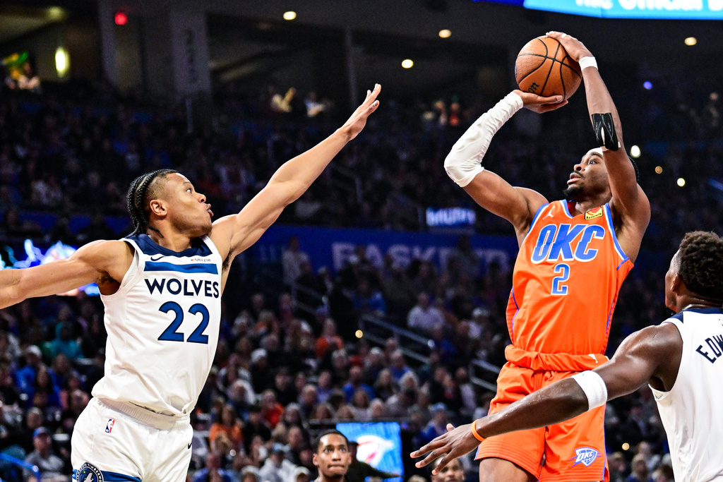Oklahoma City Thunder guard Shai Gilgeous-Alexander (2) shoots against Minnesota Timberwolves guard Jaylen Clark (22) during the first half of an Emirates NBA Cup basketball game, Wednesday, Nov. 26, 2025, in Oklahoma City. (AP Photo/Gerald Leong)