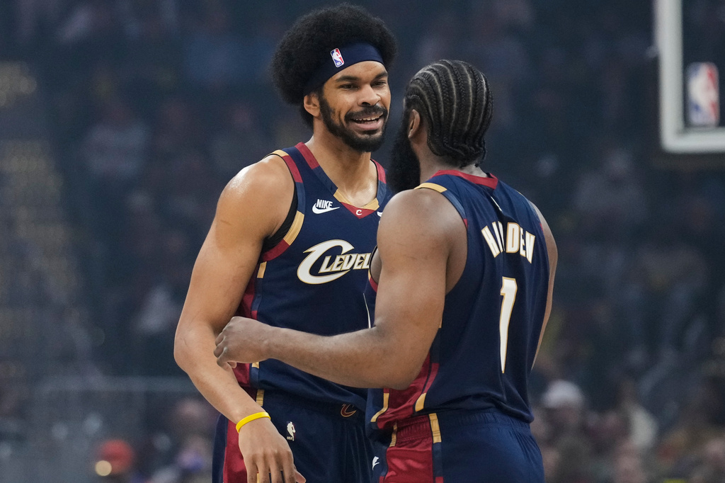 Cleveland Cavaliers center Jarrett Allen, left, celebrates with teammate James Harden (1) in the first half of an NBA basketball game against the Miami Heat in Cleveland, Friday, March 27, 2026. (AP Photo/Sue Ogrocki)