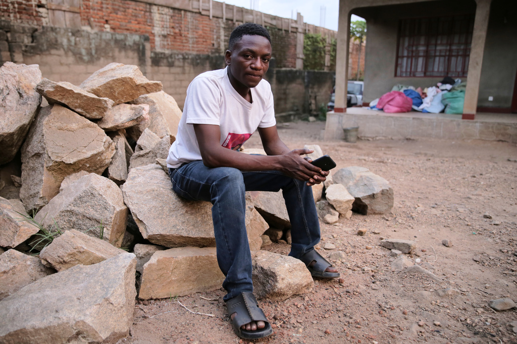 Bienfait Wanzire, an Ebola survivor, sits by his house in Beni, Congo, Monday, June 1, 2026. (AP Photo/Kitsa Musayi Sebastien)