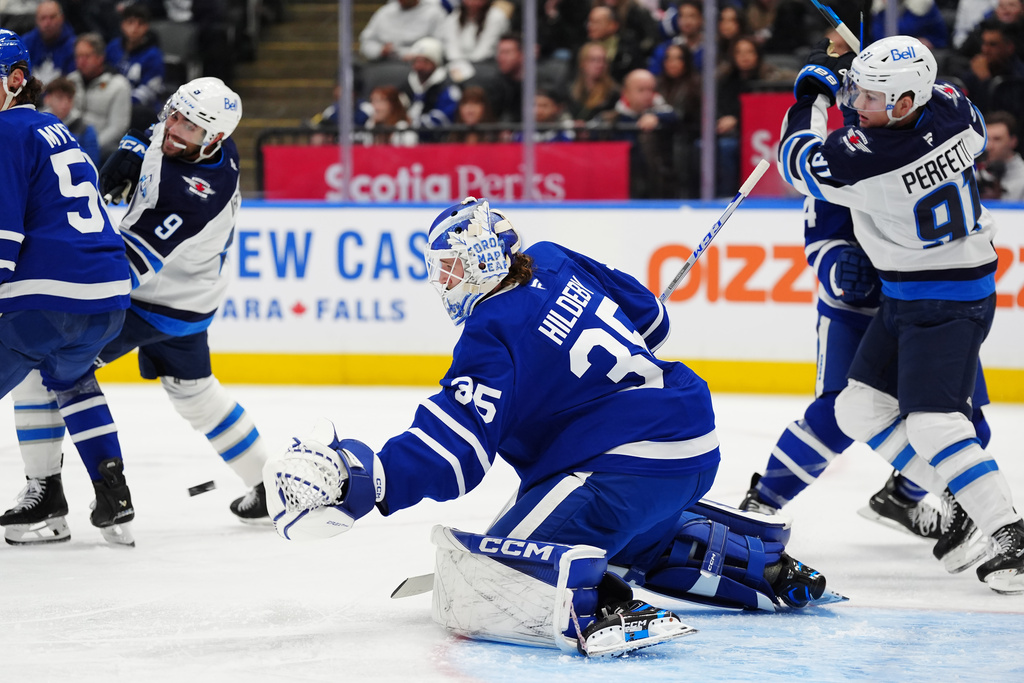Toronto Maple Leafs goaltender Dennis Hildeby (35) makes a save against the Winnipeg Jets during during the third period of an NHL hockey game in Toronto, Thursday, Jan. 1, 2026. (Frank Gunn/The Canadian Press via AP)