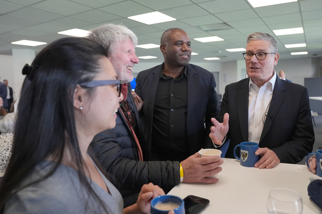 British Prime Minister Sir Keir Starmer and Foreign Secretary David Lammy meeting Labour Party members during a visit to AFC Wimbledon in south London, Saturday May 9, 2026. (Maja Smiejkowska/PA via AP)