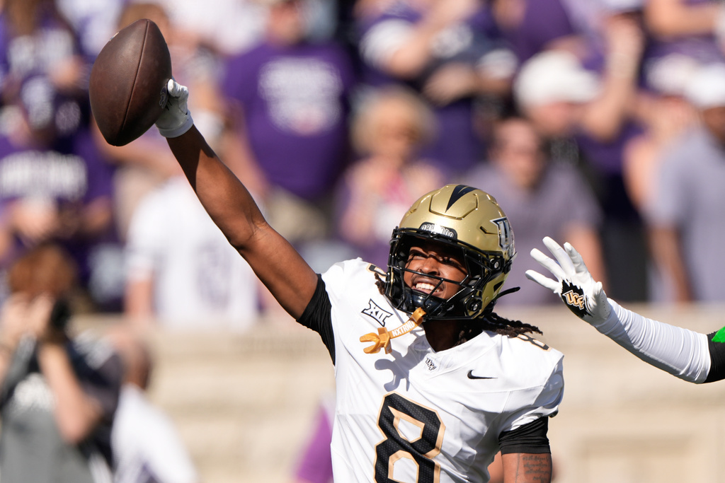 Central Florida defensive back Demari Henderson (8) celebrates after intercepting a pass intended for Kansas State tight end Will Anciaux during the first half of an NCAA college football game Saturday, Sept. 27, 2025, in Manhattan, Kan. (AP Photo/Charlie Riedel)
