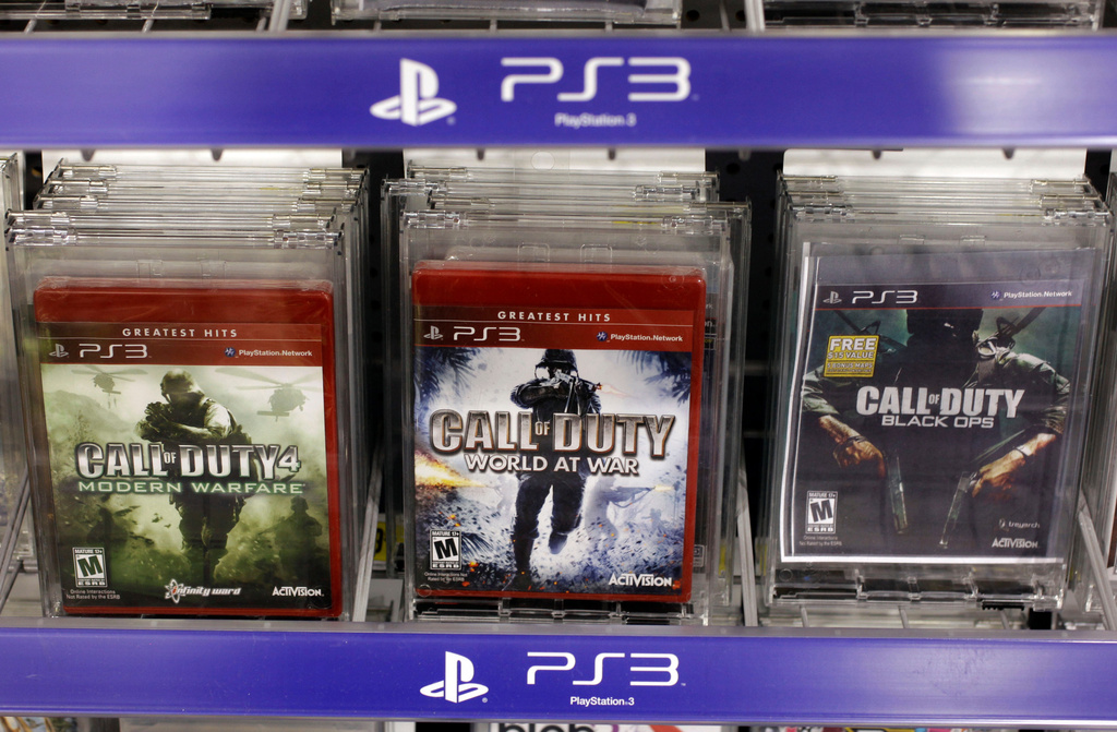 FILE - Three versions of Activision's Call Of Duty games are seen on sale at Best Buy in Mountain View, Calif., Wednesday, Aug. 3, 2011. Vincent Zampella, one of the creators behind such best-selling video games "Call of Duty," has died at 55. (AP Photo/Paul Sakuma,File)