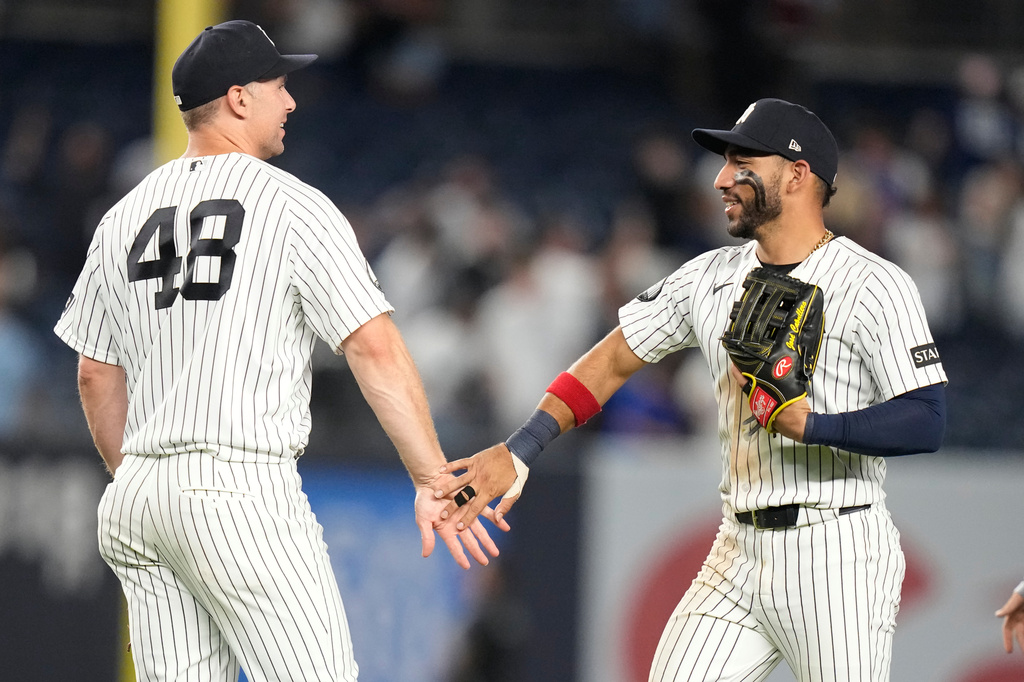 New York Yankees' Paul Goldschmidt, left, celebrates with José Caballero after a baseball game against the Chicago White Sox Wednesday, June 17, 2026, in New York. (AP Photo/Frank Franklin II)