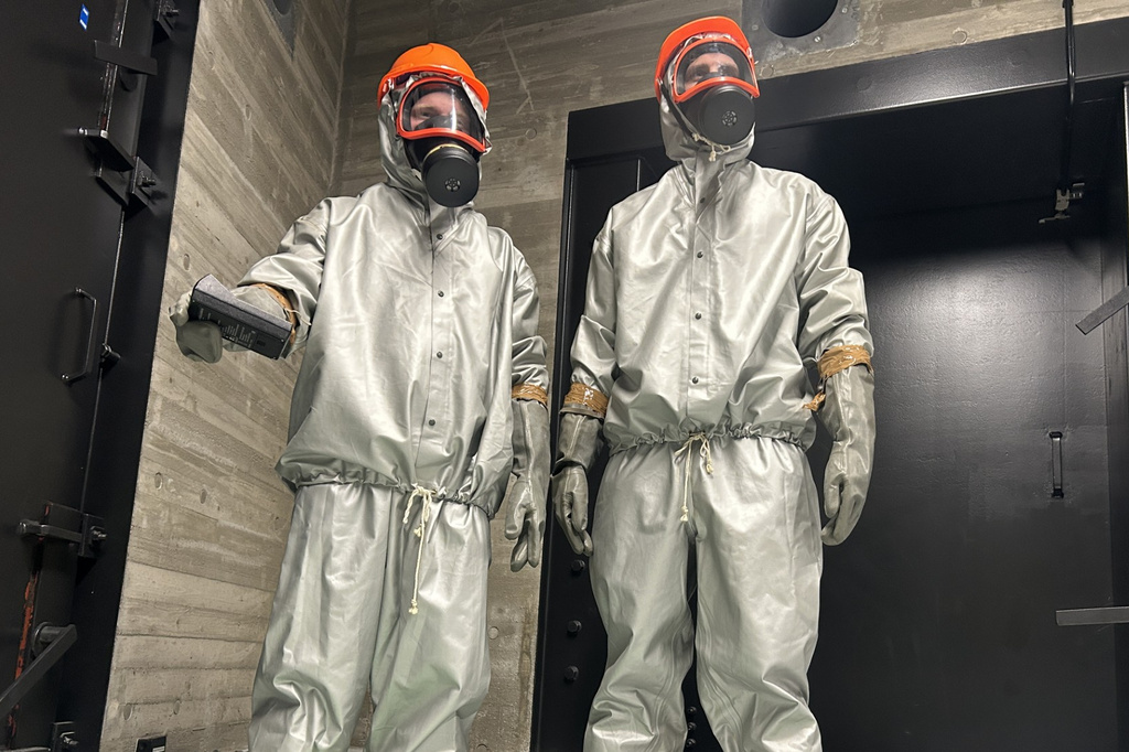Finnish conscripts measure radiation levels at a shelter in Kuopio, Finland, during a civil defense exercise Wednesday, Sept. 2, 2026. (AP Photo/Emma Burrows)