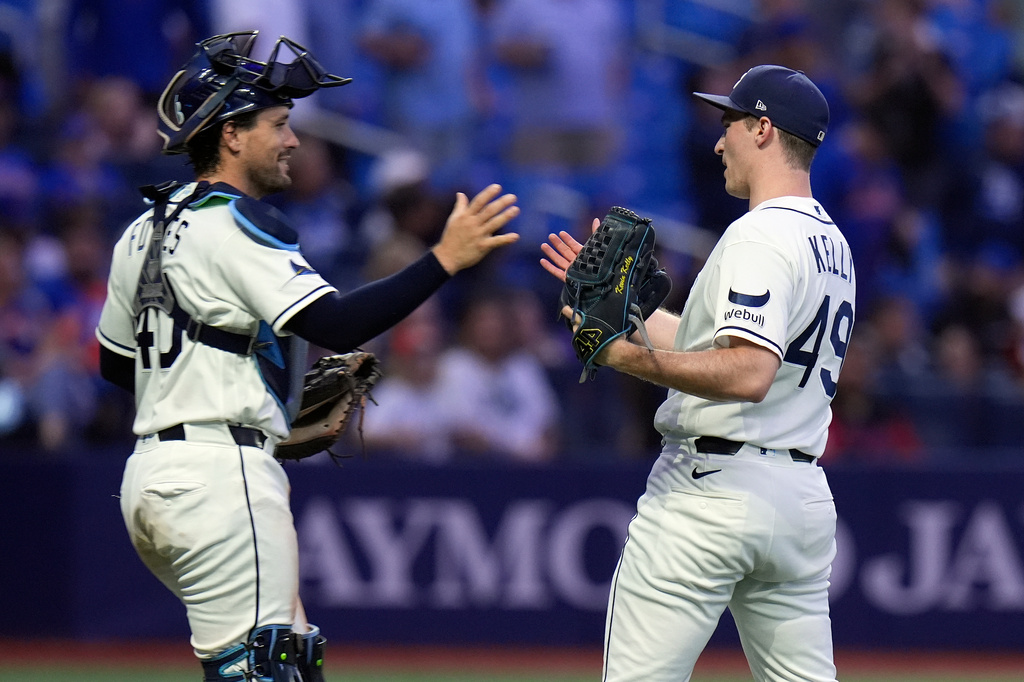 Tampa Bay Rays pitcher Kevin Kelly (49) celebrates with catcher Nick Fortes after closing out the New York Mets during the ninth inning of a baseball game Tuesday, Sept. 1, 2026, in St. Petersburg, Fla. (AP Photo/Chris O'Meara)