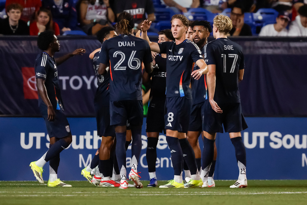 San Diego FC's Onni Valakari (8) is congratulated by teammates after scoring on a penalty kick during an MLS soccer match against FC Dallas, Saturday, March 14, 2026, in Frisco, Texas. (AP Photo/Brandon Wade)