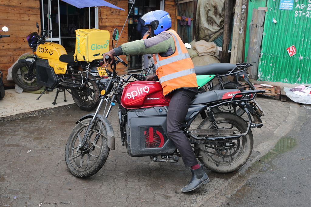 A rider sits on an electric Spiro motorcycle in Nairobi, Kenya, Tuesday, Feb. 24, 2026. (AP Photo/Henry Naminde)