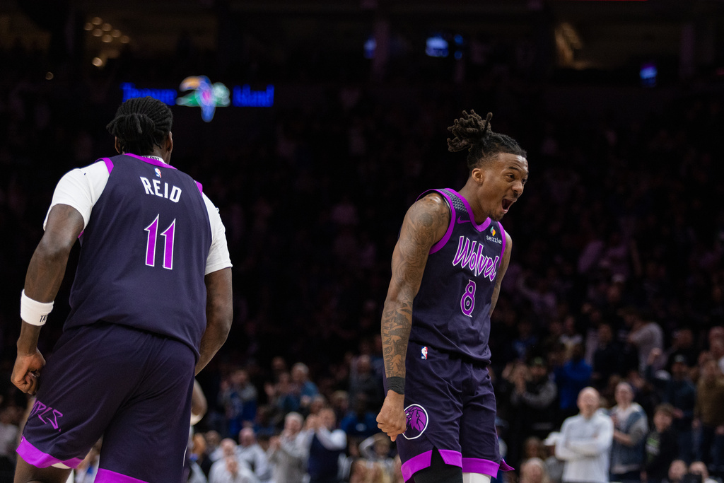 Minnesota Timberwolves' Bones Hyland (8) celebrates a basket against the Dallas Mavericks during the first half of an NBA basketball game Friday, Feb. 20, 2026, in Minneapolis. (AP Photo/Lily Dozier)