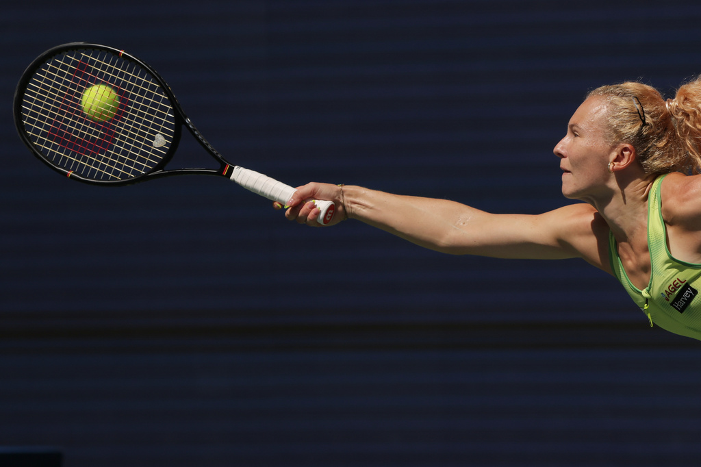 Katerina Siniakova, of the Czech Republic, returns the ball to Naomi Osaka, of Japan, during the second round of the U.S. Open tennis championships against Thursday, Sept. 3, 2026, in New York. (AP Photo/Andres Kudacki)