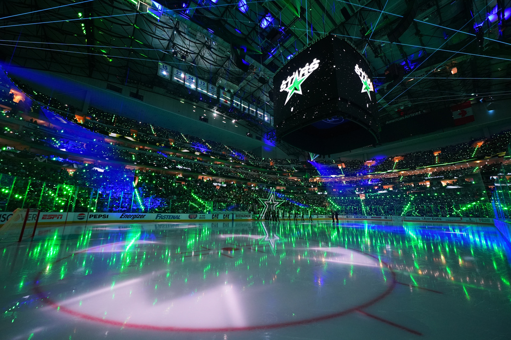 FILE - American Airlines Center is lit up prior to Game 5 of a first-round NHL Stanley Cup playoffs hockey series between the Dallas Stars and the Minnesota Wild, April 28, 2026, in Dallas. (AP Photo/Julio Cortez, File)