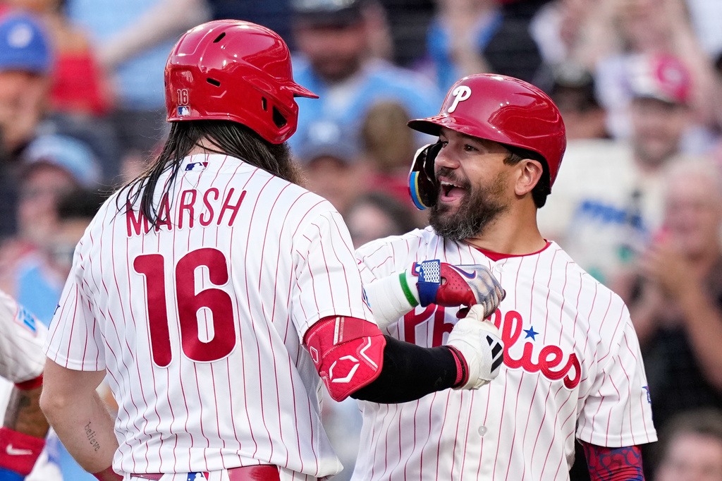 Philadelphia Phillies' Brandon Marsh, left, and Kyle Schwarber celebrate after Marsh's home run against Miami Marlins pitcher Tyler Phillips during the second inning of a baseball game Tuesday, June 16, 2026, in Philadelphia. (AP Photo/Matt Slocum)