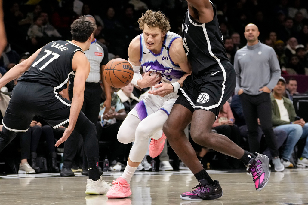 Utah Jazz forward Lauri Markkanen, center, loses control of the ball during the first half of an NBA basketball game against the Brooklyn Nets, Thursday, Dec. 4, 2025, in New York. (AP Photo/Yuki Iwamura)