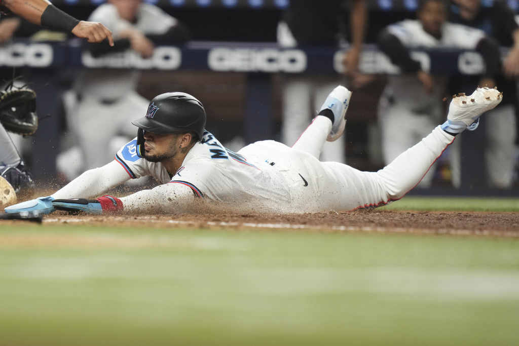 Miami Marlins' Victor Mesa Jr. scores on a double hit by Eric Wagaman during the eighth inning of a baseball game against the Washington Nationals Thursday, Sept. 11, 2025, in Miami. (AP Photo/Lynne Sladky)
