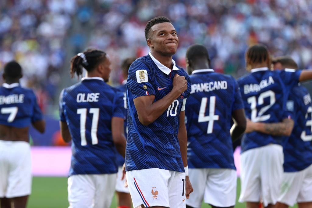 France's Kylian Mbappe (10) celebrates scoring their third goal during the World Cup round of 32 soccer match between France and Sweden in East Rutherford, N.J., near New York, Tuesday, June 30, 2026. (AP Photo/Pamela Smith)