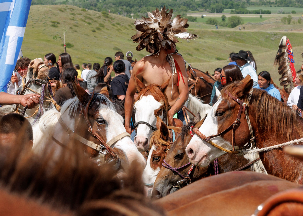 Horses rest after the horse charging event during festivities to commemorate the 150th anniversary of the Battle of the Little Bighorn in Crow Agency, Mont., on Thursday, June 25, 2026. (AP Photo/Tailyr Irvine)