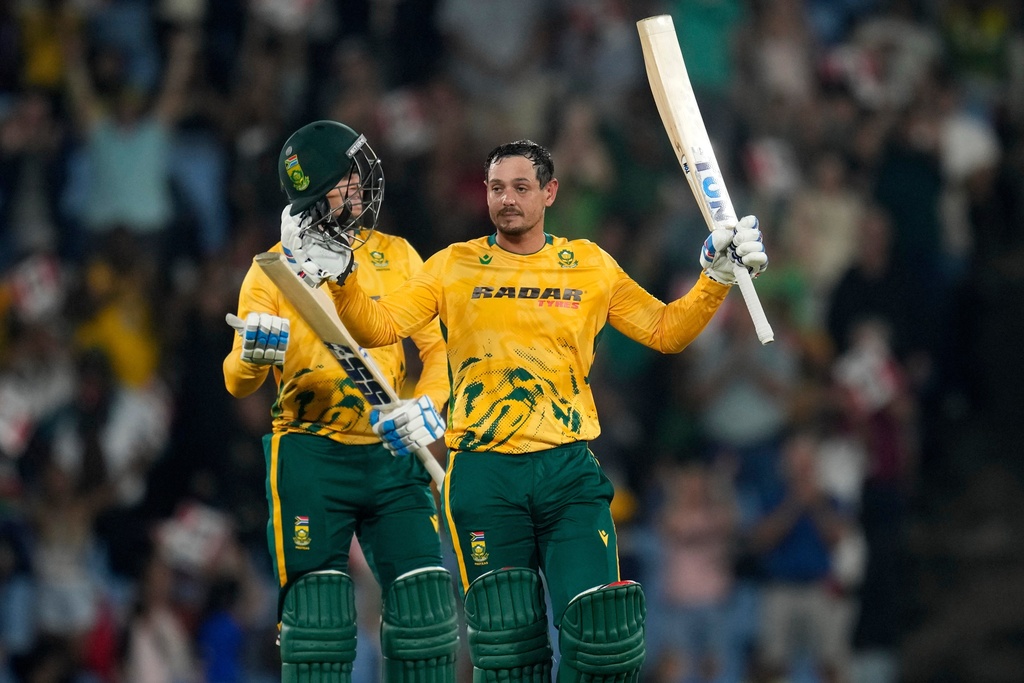 South Africa's batsman Quinton de Kock raises his bat after reaching a century during the T20 International cricket match between South Africa and West Indies, in Centurion, South Africa, Thursday, Jan. 29, 2026. (AP Photo/Themba Hadebe)