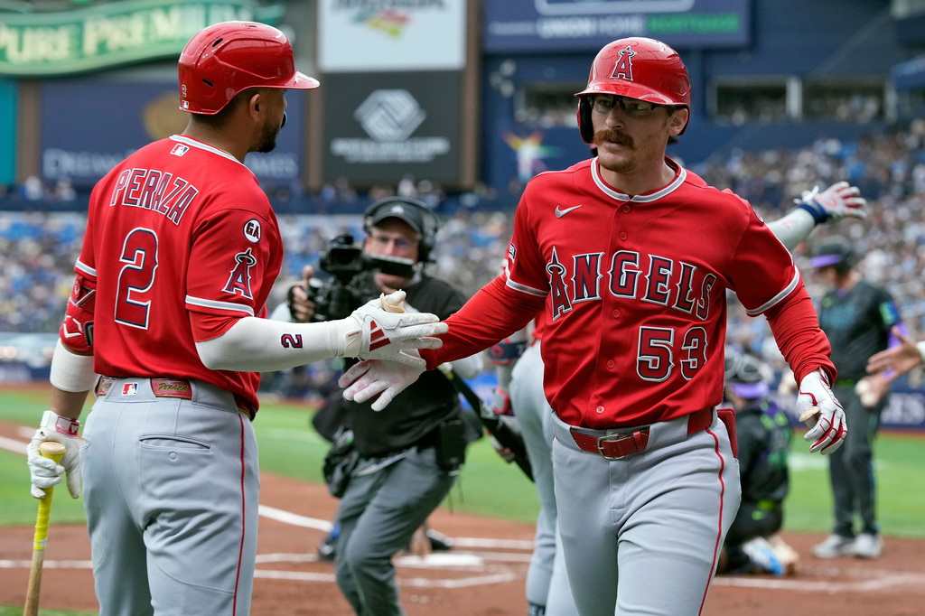 Los Angeles Angels' Wade Meckler (53) celebrates his grand slam off Tampa Bay Rays pitcher Drew Rasmussen with Oswald Peraza (2) during the first inning of a baseball game Saturday, May 30, 2026, in St. Petersburg, Fla. (AP Photo/Chris O'Meara)