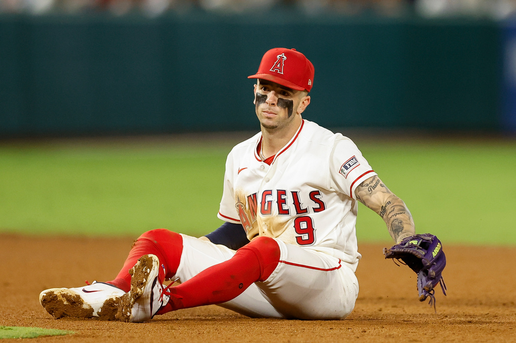 Los Angeles Angels shortstop Zach Neto (9) reacts after a ground ball gets past him during the fifth inning of a baseball game against the Seattle Mariners, Wednesday, Sept. 16, 2026, in Anaheim, Calif. (AP Photo/Caroline Brehman)