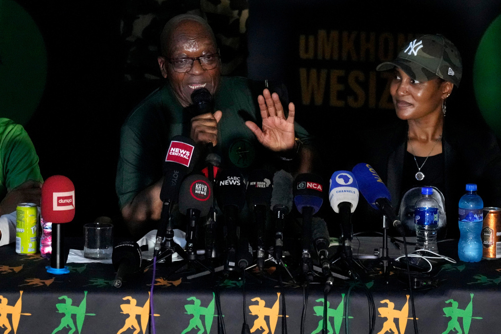 FILE - Former South African President Jacob Zuma, speaks as his daughter Duduzile Zuma-Sambudla, right, listens, during a press conference in Soweto, South Africa, Dec. 16, 2023. (AP Photo/Themba Hadebe, File)
