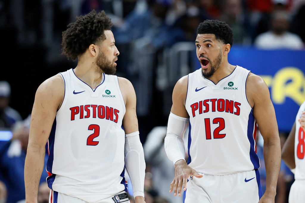 Detroit Pistons forward Tobias Harris (12) reads to a basket scored against the Orlando Magic by guard Cade Cunningham (2) during the second half in Game 5 of a first-round NBA basketball playoffs series Wednesday, April 29, 2026, in Detroit. (AP Photo/Duane Burleson)