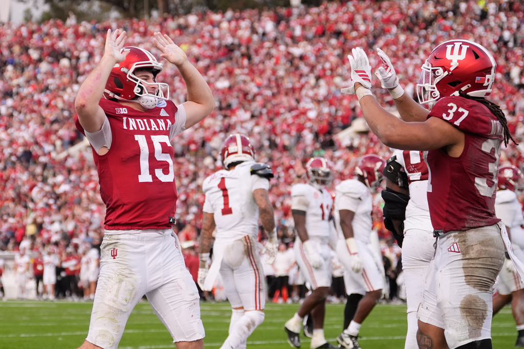 Indiana quarterback Fernando Mendoza (15) celebrates with tight end Riley Nowakowski (37) after a rushing touchdown by running back Kaelon Black during the second half of the Rose Bowl College Football Playoff quarterfinal game Thursday, Jan. 1, 2026, in Pasadena, Calif. (AP Photo/Mark J. Terrill)
