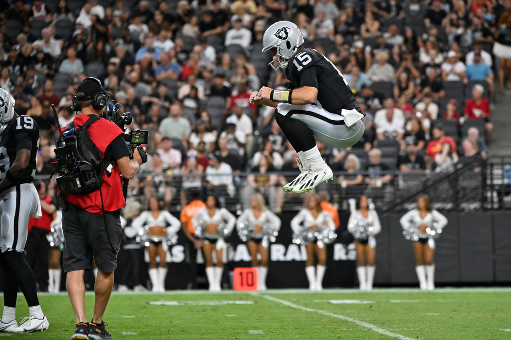 Las Vegas Raiders quarterback Fernando Mendoza warms up on the field during the first half of a preseason NFL football game against the Arizona Cardinals, Thursday, Aug. 13, 2026, in Las Vegas. (AP Photo/David Becker)