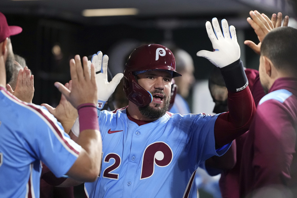 Philadelphia Phillies' Kyle Schwarber reacts after hitting a two-run home run against Atlanta Braves pitcher Austin Cox during the fourth inning of a baseball game Thursday, Aug. 28, 2025, in Philadelphia. (AP Photo/Matt Slocum)