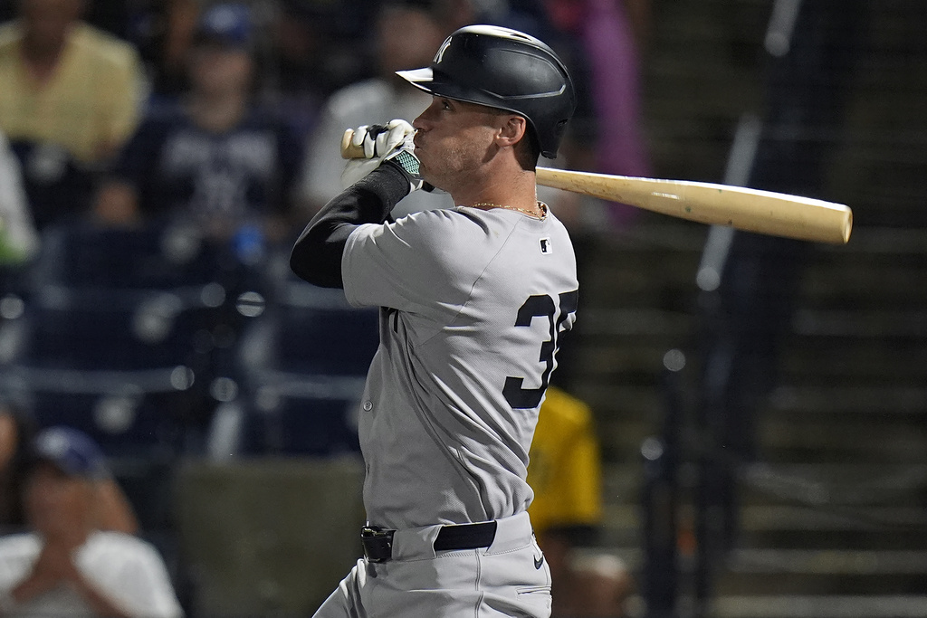 New York Yankees' Cody Bellinger watches his solo home run off Tampa Bay Rays pitcher Shane Baz during the first inning of a baseball game Tuesday, Aug. 19, 2025, in Tampa, Fla. (AP Photo/Chris O'Meara)