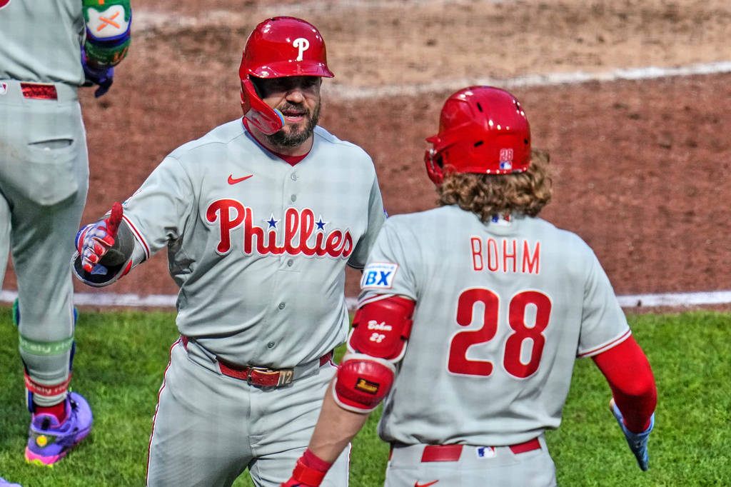 Philadelphia Phillies' Kyle Schwarber, left, celebrates with Alec Bohm (28) as he returns to the dugout after hitting a two-run home run off Pittsburgh Pirates pitcher Braxton Ashcraft during the fifth inning of a baseball game in Pittsburgh, Friday, May 15, 2026. (AP Photo/Gene J. Puskar)
