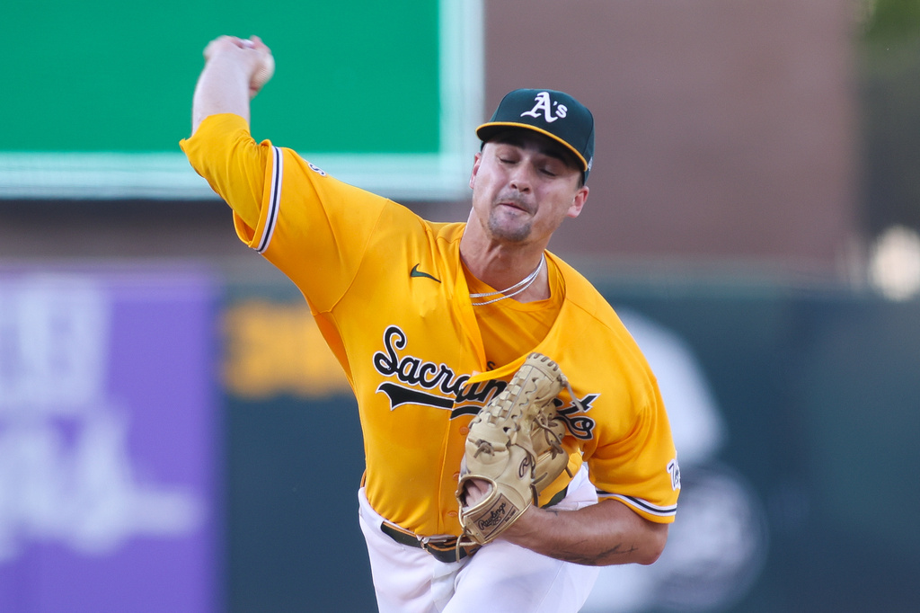 Athletics pitcher J.T. Ginn throws to a New York Yankees batter during the first inning of a baseball game Saturday, May 30, 2026, in West Sacramento, Calif. (AP Photo/Scott Marshall)