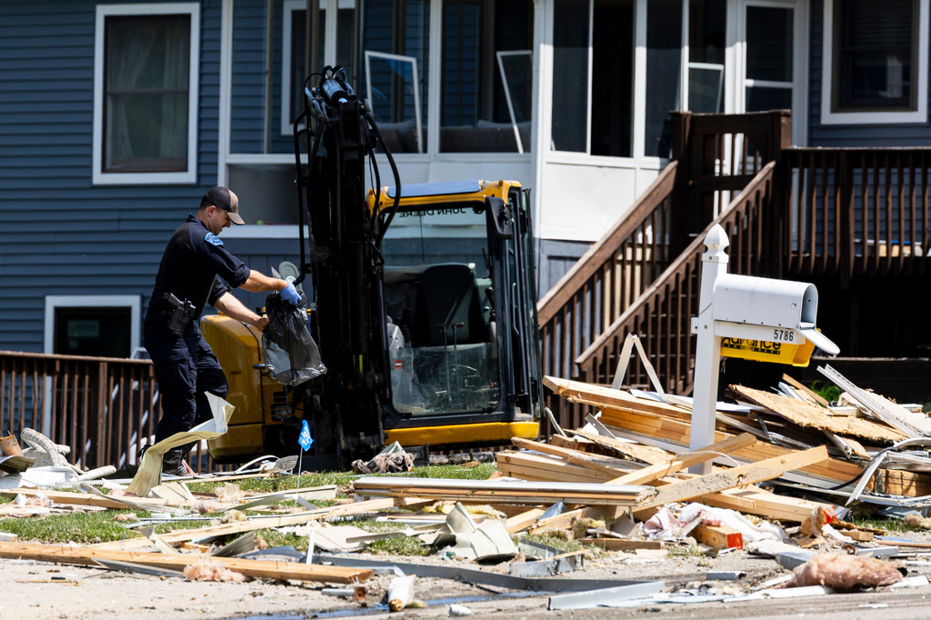 First responders work at the scene of an explosion at a home in Comstock Park, Mich. on Tuesday, May 26, 2026. (Joel Bissell/Kalamazoo Gazette via AP)