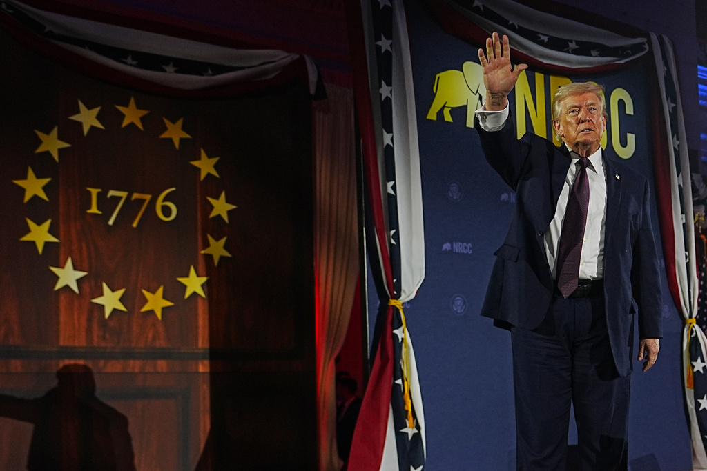 President Donald Trump waves after speaking at the National Republican Congressional Committee's (NRCC) annual fundraising dinner, Wednesday, March 25, 2026, at Union Station in Washington. (AP Photo/Julia Demaree Nikhinson)