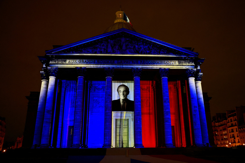 The Pantheon monument is illuminated during the induction ceremony of former French Justice Minister Robert Badinter, a revered rights defender who spearheaded France's drive to end the death penalty, Thursday, Oct. 9, 2025 in Paris. (Stephanie Lecocq/Pool photo via AP)