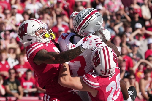 Ohio State's Carnell Tate catches a touchdown pass in front of Wisconsin's Austin Brown and Matt Jung during the first half of an NCAA college football game Saturday, Oct. 18, 2025, in Madison, Wis. (AP Photo/Morry Gash) Ohio State's Carnell Tate catches a touchdown pass in front of Wisconsin's Austin Brown and Matt Jung during the first half of an NCAA college football game Saturday, Oct. 18, 2025, in Madison, Wis. (AP Photo/Morry Gash)