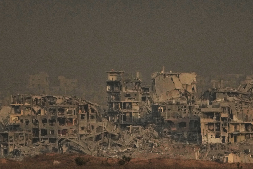 Buildings that were destroyed during the Israeli ground and air operations stand in the northern Gaza Strip, as seen from southern Israel, Thursday, Oct. 9, 2025, following the announcement that Israel and Hamas have agreed to the first phase of a peace plan to pause the fighting. (AP Photo/Ariel Schalit)