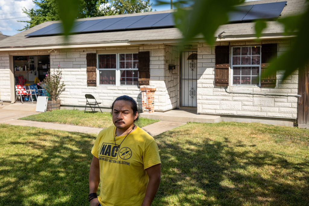David Espinoza, Hub home captain and co-director of community organizing at West Street Recovery, stands in front of Doris Brown's hub home, Wednesday, Oct. 8, 2025, in Houston. (AP Photo/Antranik Tavitian)