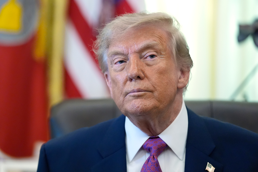 President Donald Trump listens as a reporter asks a question in the Oval Office of the White House, Thursday, Aug. 27, 2026, in Washington. (AP Photo/Manuel Balce Ceneta)