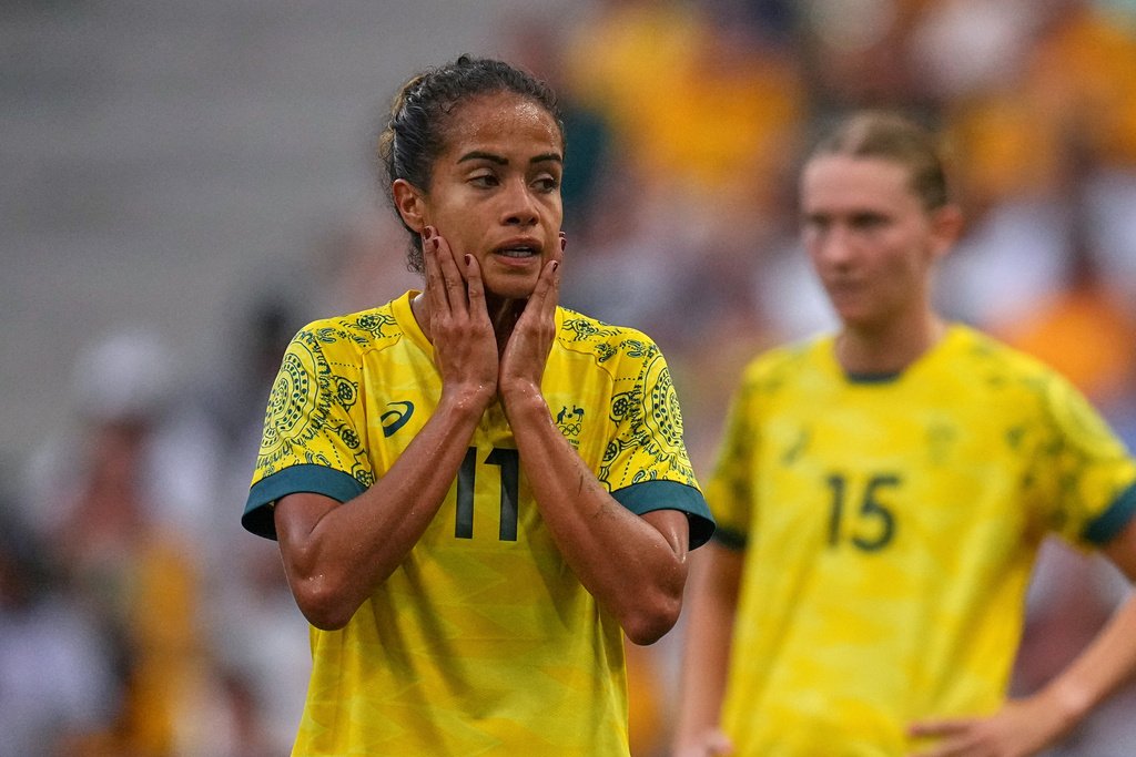 FILE - Australia's Mary Fowler, left, reacts during a women's Group B soccer match between Australia and the United States, at the Marseille Stadium, at the 2024 Summer Olympics, July 31, 2024, in Marseille, France. (AP Photo/Daniel Cole, file)
