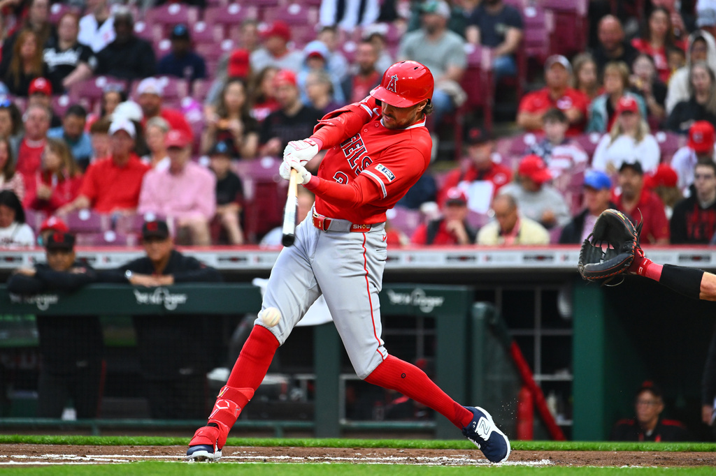 Los Angeles Angels' Josh Lowe hits a single during the second inning of a baseball game against the Cincinnati Reds in Cincinnati, Friday, April 10, 2026. (AP Photo/Ben Jackson)