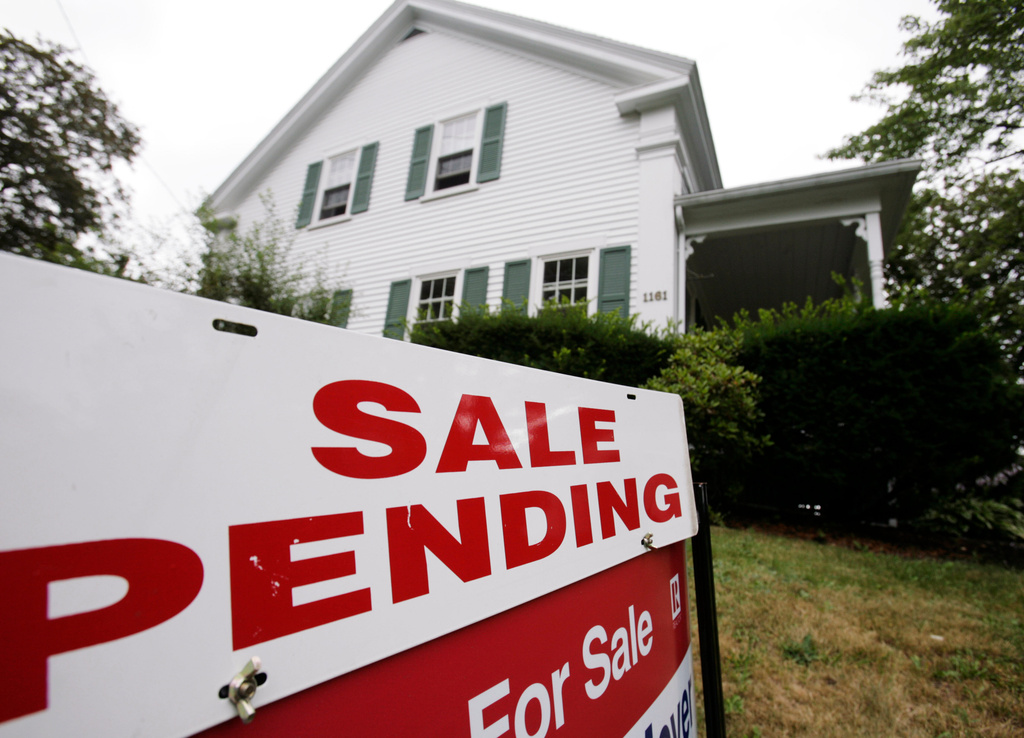 FILE - In this July 26, 2011 photo, a sale pending sign is posted outside a house in Bath, Maine. (AP Photo/Pat Wellenbach, File)