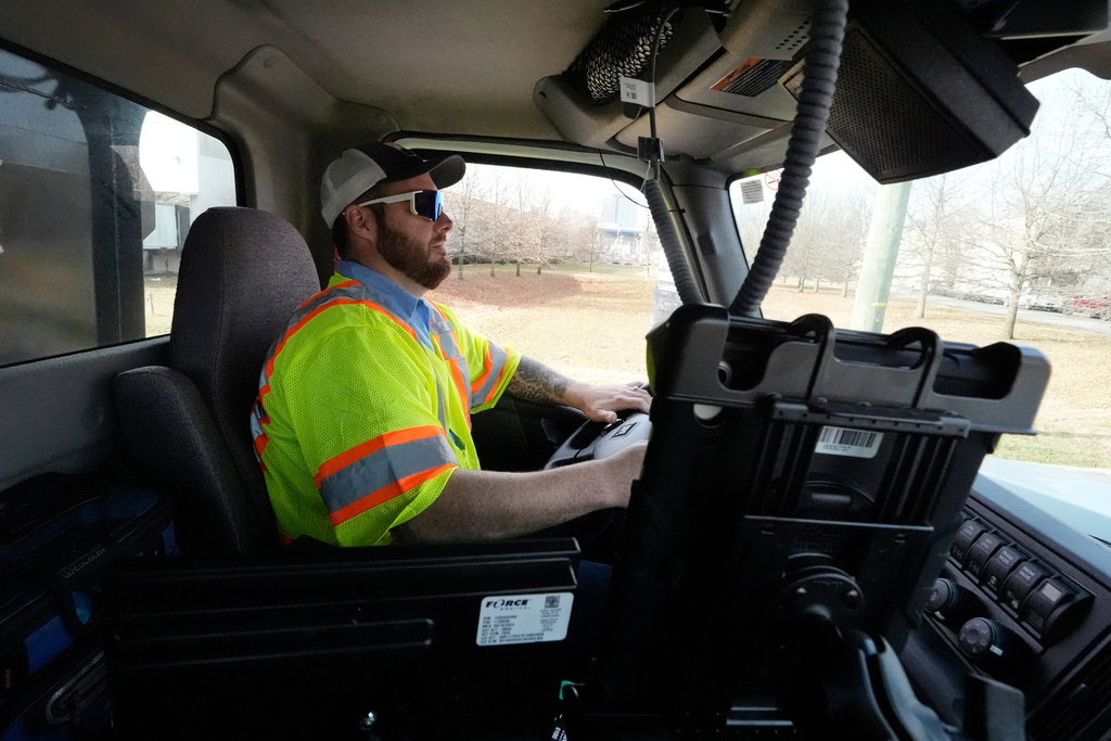 Austin Felts of the Nashville Department of Transportation drives a truck deploying salt brine on roadways Thursday, Jan. 22, 2026, in Nashville, Tenn. ahead of a winter storm expected to hit the state over the weekend. (AP Photo/George Walker IV)