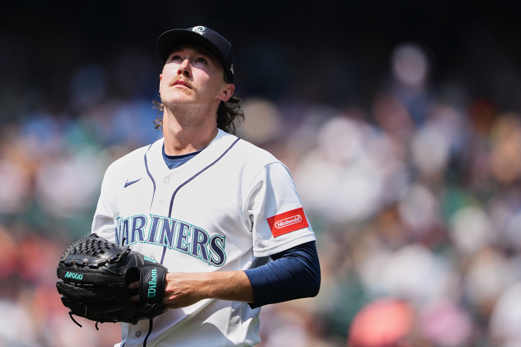 Seattle Mariners starting pitcher Bryce Miller walks back to the dugout after the third inning of a baseball game against the Detroit Tigers, Thursday, Aug. 6, 2026, in Seattle. (AP Photo/Lindsey Wasson)