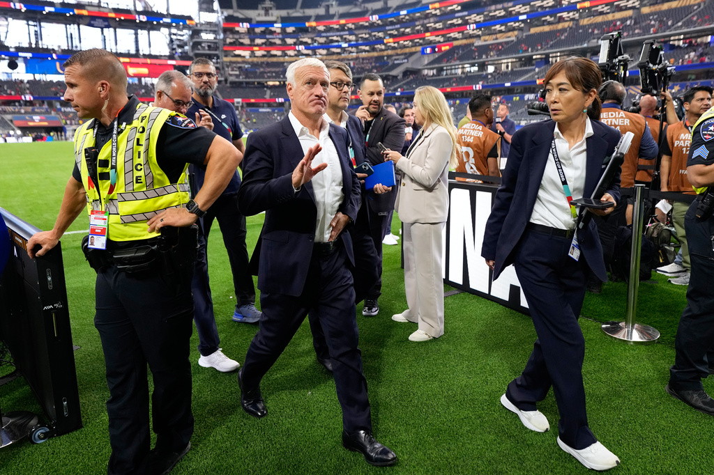 France head coach Didier Deschamps leaves the pitch at the end of the World Cup semifinal soccer match between France and Spain in Arlington, Texas, near Dallas, Tuesday, July 14, 2026. (AP Photo/Ashley Landis)