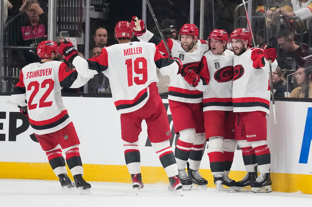 Carolina Hurricanes right wing Jackson Blake, second from right, celebrates his goal with teammates during the second period in Game 6 of the NHL hockey Stanley Cup Final series against the Vegas Golden Knights, Sunday, June 14, 2026, in Las Vegas. (AP Photo/John Locher)
