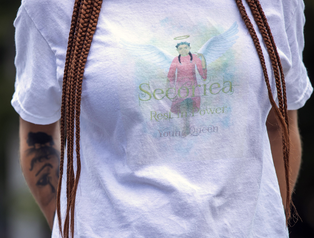 FILE- Charmaine Turner wears a T-shirt featuring an image of her late daughter Secoriea Turner during a news conference outside of the Fulton County Courthouse in downtown Atlanta, Friday, Aug. 13, 2021. (Alyssa Pointer/Atlanta Journal-Constitution via AP, File)