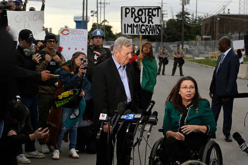 Sen. Tammy Duckworth, D-Ill., speaks to the media while Sen. Dick Durbin, D-Ill., listens outside the U.S. Immigration and Customs Enforcement facility in Broadview, Ill., Friday, Oct. 10, 2025. (AP Photo/Paul Beaty) Sen. Tammy Duckworth, D-Ill., speaks to the media while Sen. Dick Durbin, D-Ill., listens outside the U.S. Immigration and Customs Enforcement facility in Broadview, Ill., Friday, Oct. 10, 2025. (AP Photo/Paul Beaty)