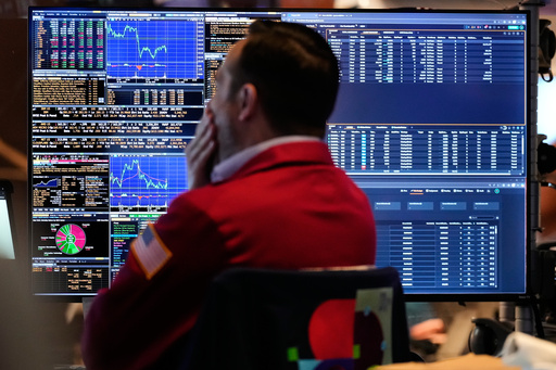 A trader looks at financial information on his computer on the floor at the New York Stock Exchange in New York, Wednesday, Oct. 1, 2025. (AP Photo/Seth Wenig) A trader looks at financial information on his computer on the floor at the New York Stock Exchange in New York, Wednesday, Oct. 1, 2025. (AP Photo/Seth Wenig)