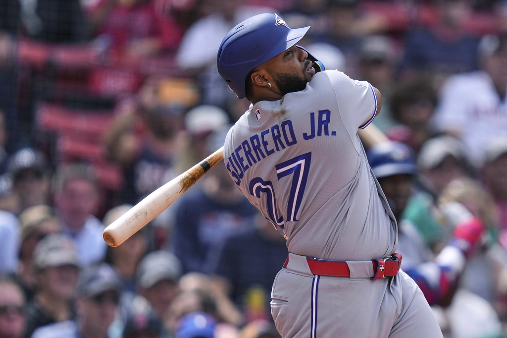 Toronto Blue Jays' Vladimir Guerrero Jr. watches the flight of his fly out during the eighth inning of a baseball game against the Boston Red Sox's, Thursday, June 18, 2026, in Boston. (AP Photo/Charles Krupa)